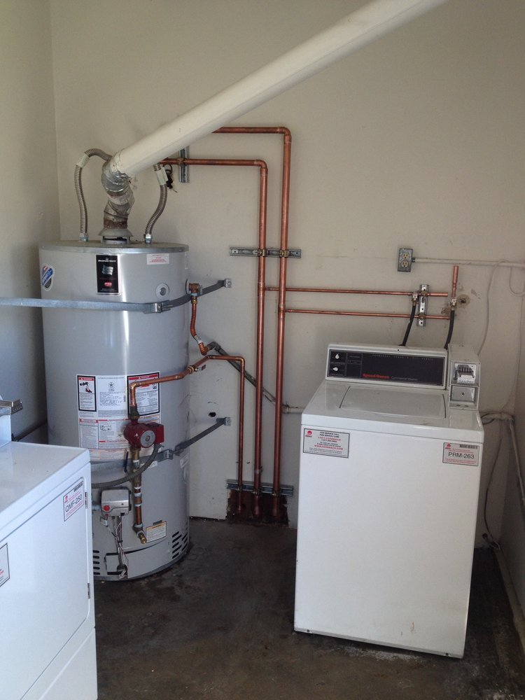 A water heater installation with copper supply lines by A&W Plumbing